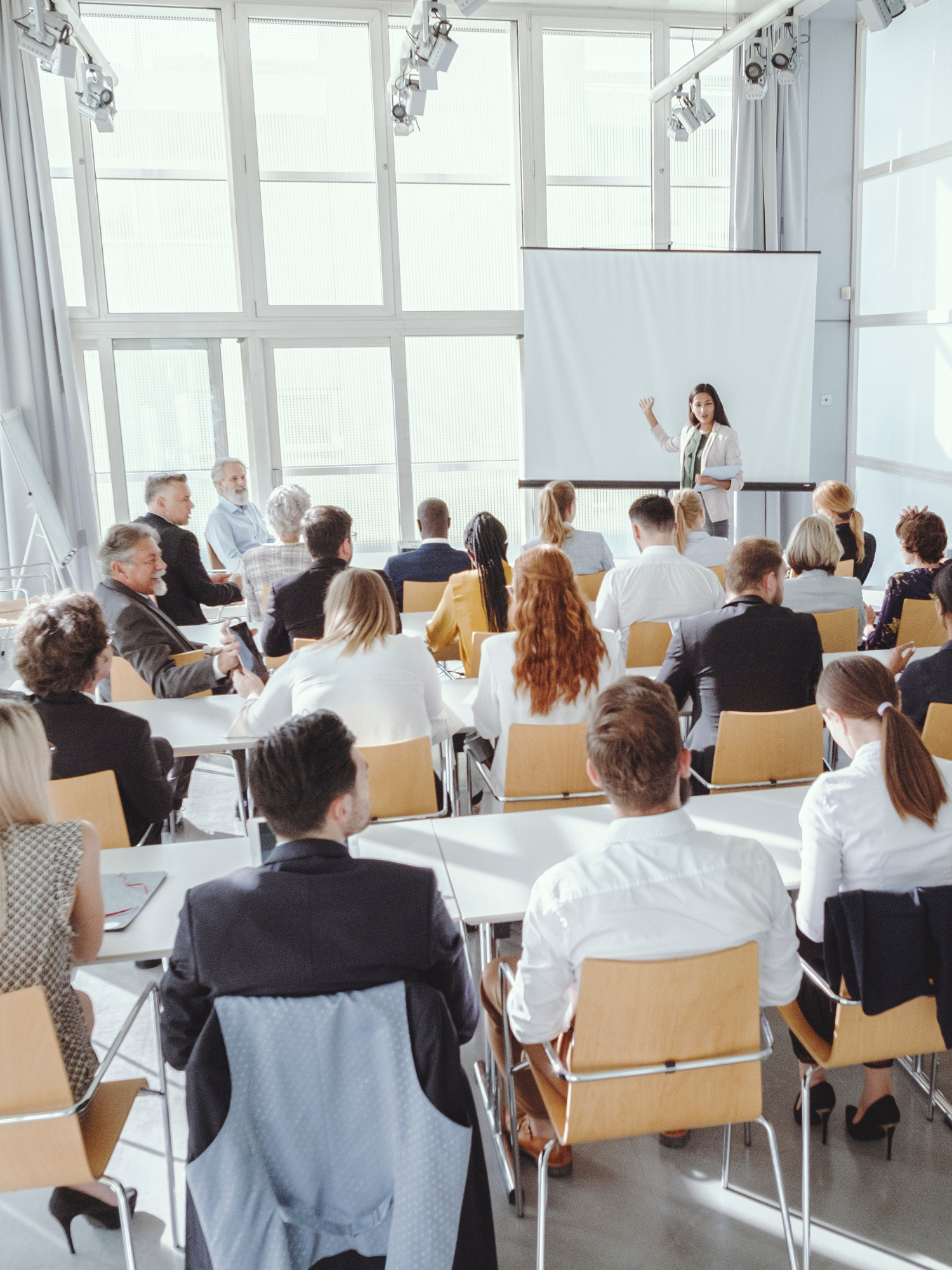 Woman leading a seminar for corporate clients
